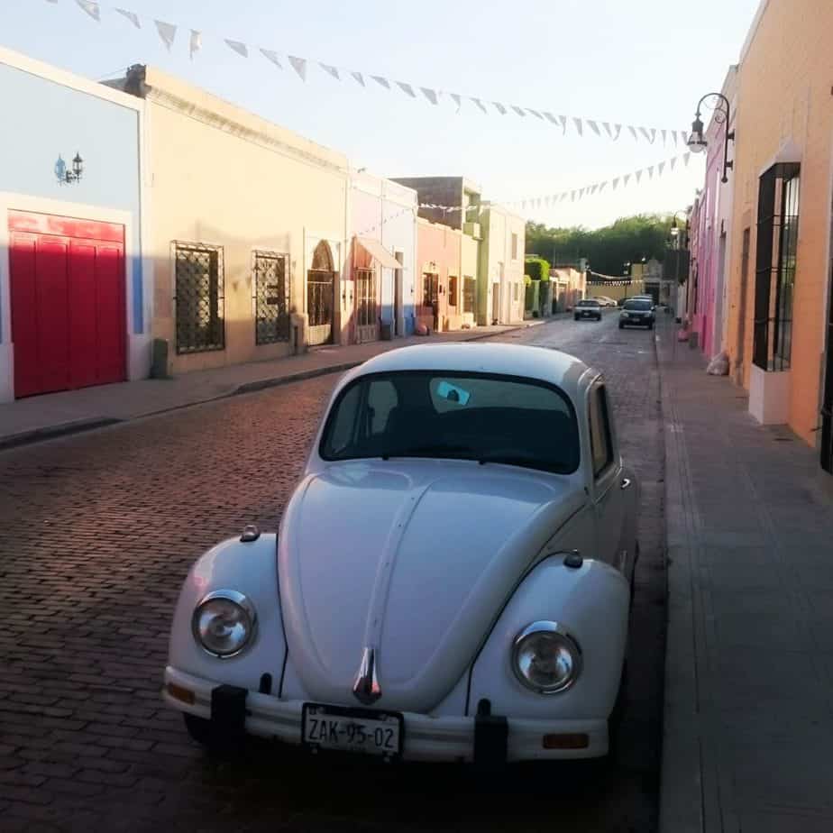 white beetle car on road