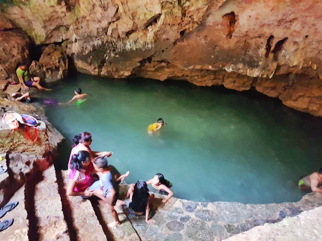 Cenote in Telchaquillo - people swimming