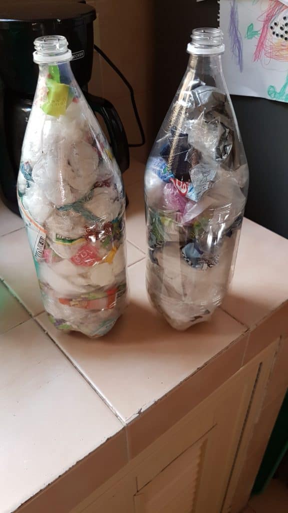 Two eco bricks (plastic bottles filled with plastic waste)