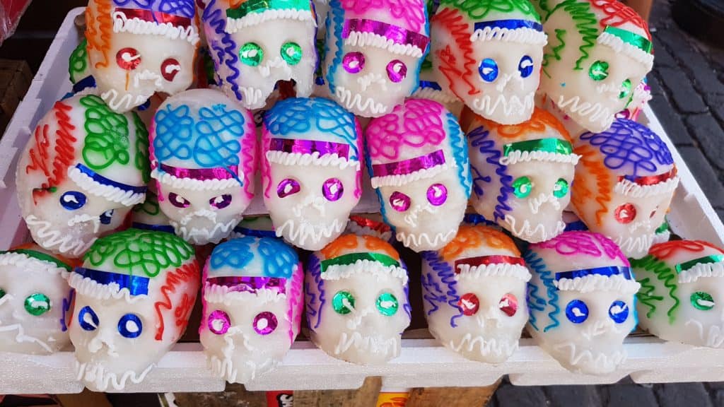 Día de Muertos sugar skulls, blue and pink heads