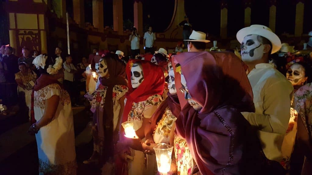 what to do in Merida hanal pixan people dressed up holding candles