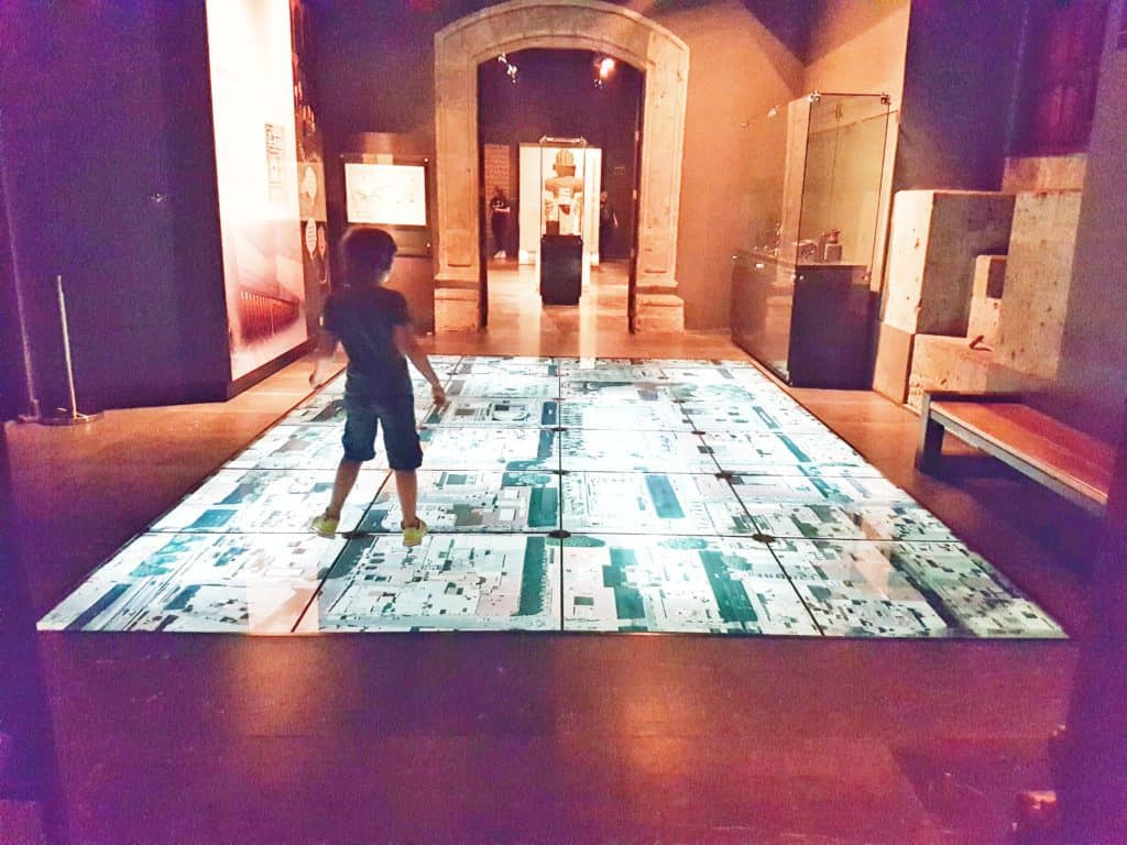 kid on an interactive floor map