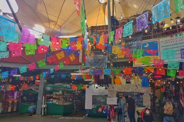 market entrance, Mexican colourful flags (paper cuts)