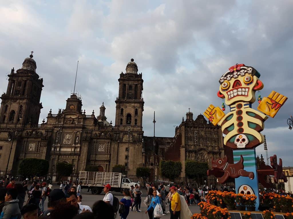 Mexico City cathedral with large skeleton decoration in foreground