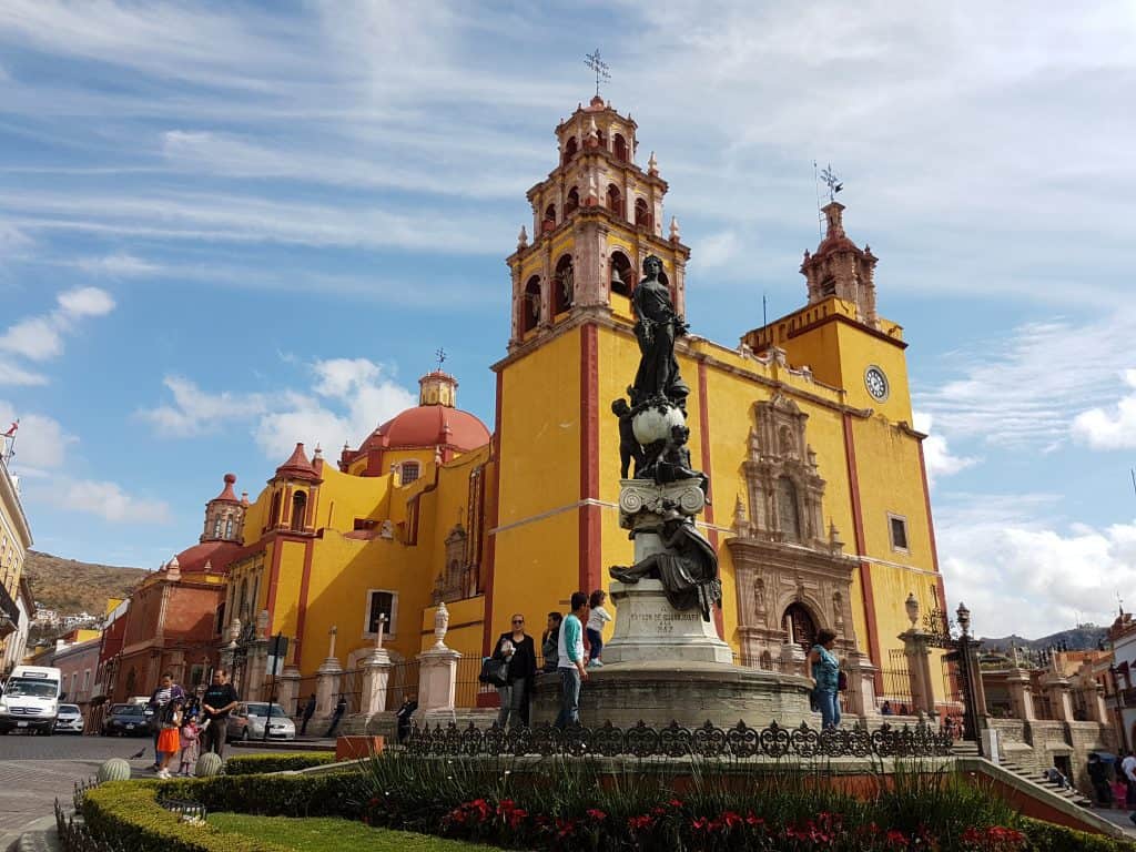 Plaza de la Paz, Guanajuasculpture with big yellow church in background)