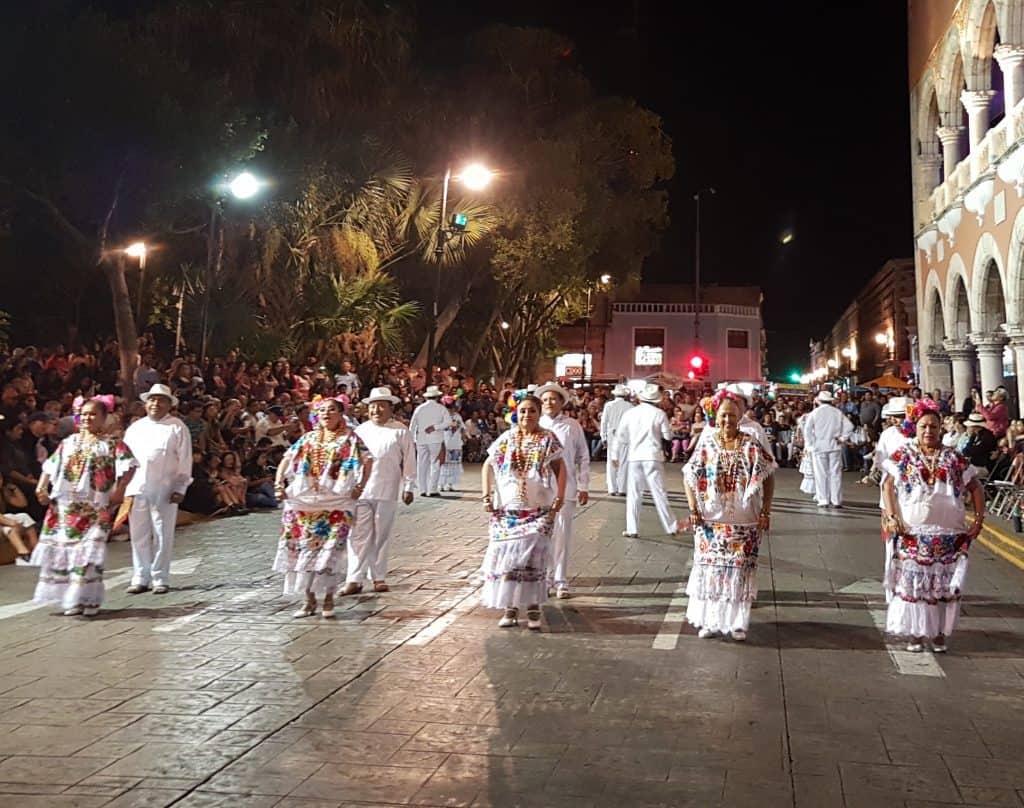 Yucatecan people dancing in traditional white costumes