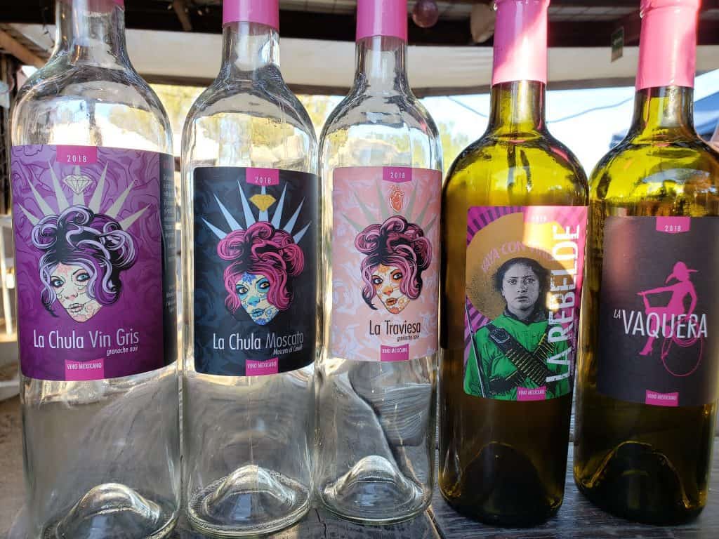 Empty bottles of Valley Girl wine - the labels are all fun pictures of women