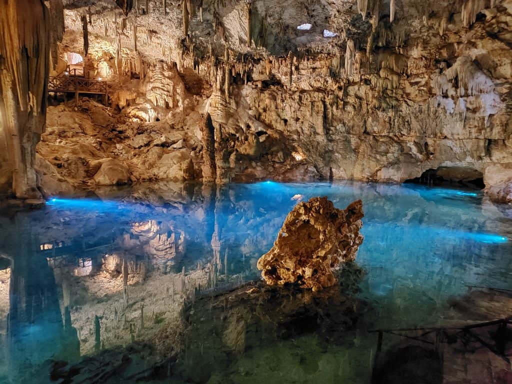 cave cenote. Bright clear blue water, stalactites