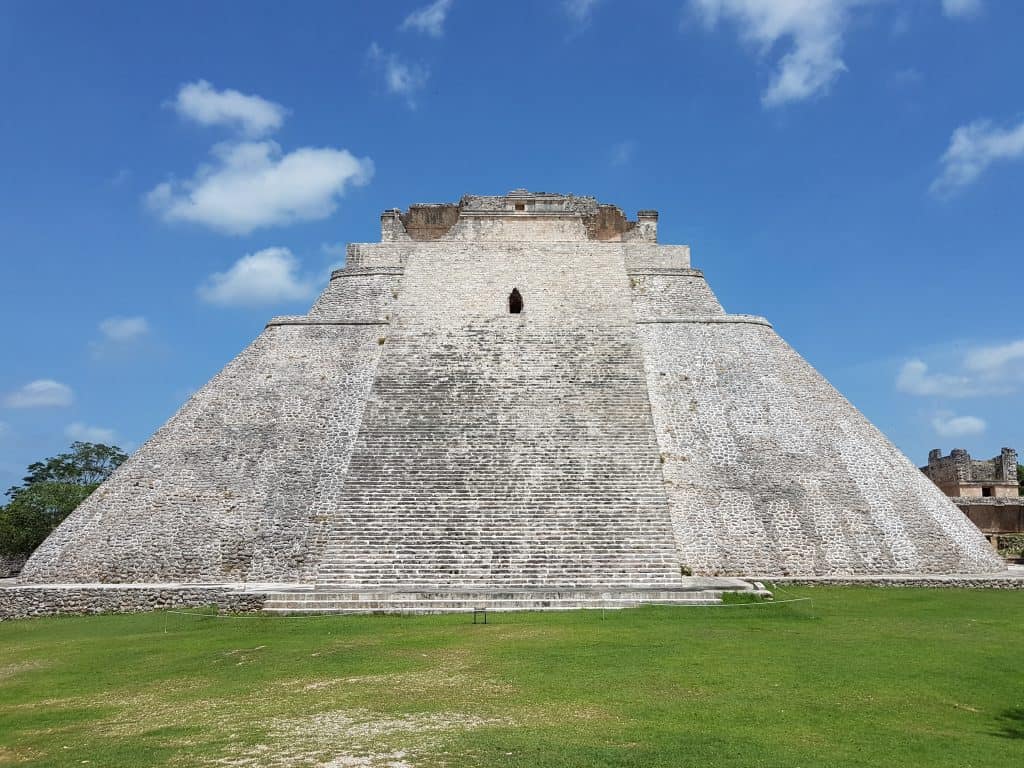 bright photo, Uxmal pyramid, no people in view, blue sky
