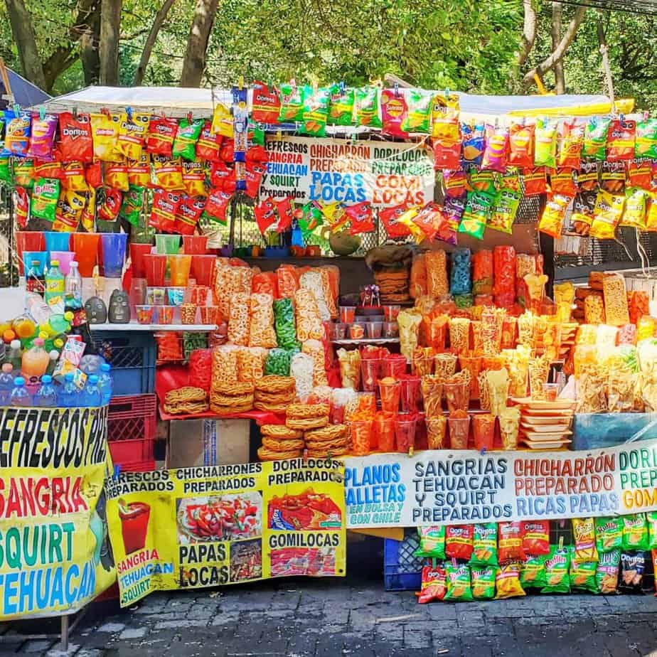 bright coloured stand full of snacks and posters advertising the snacks