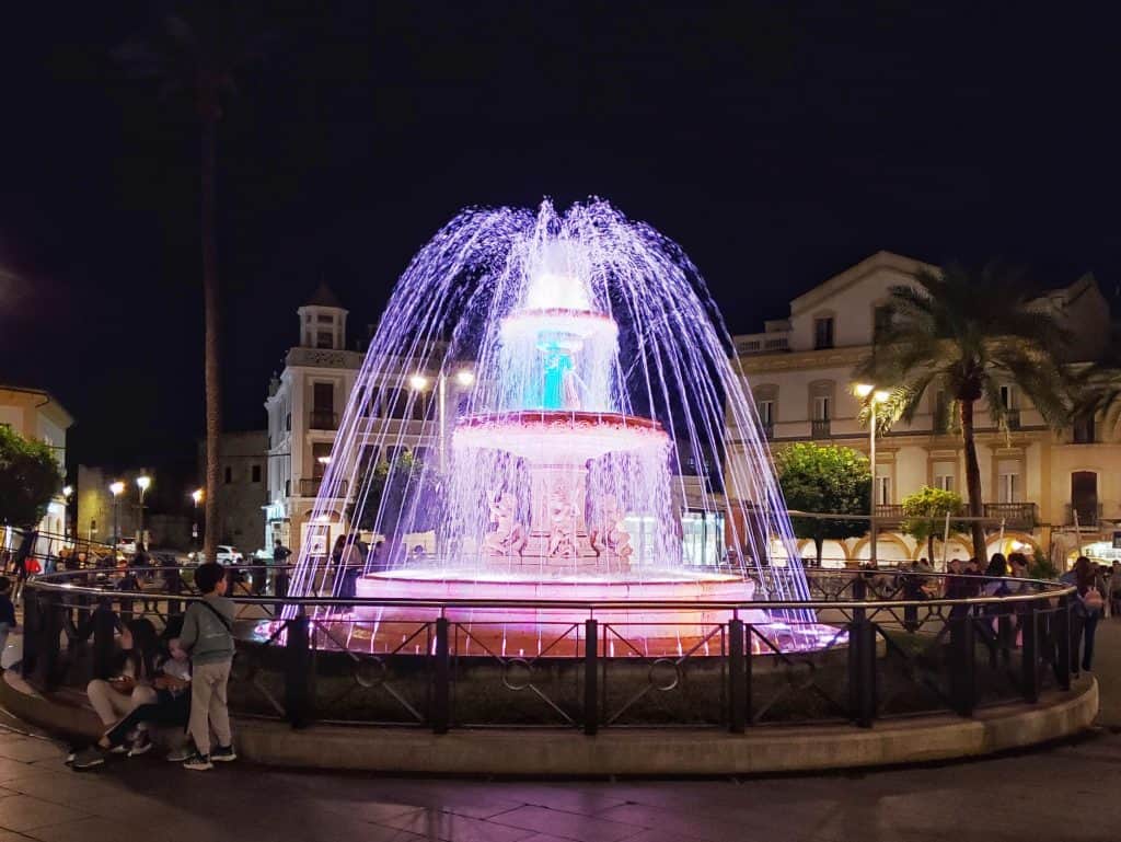 fountain lit up at night
