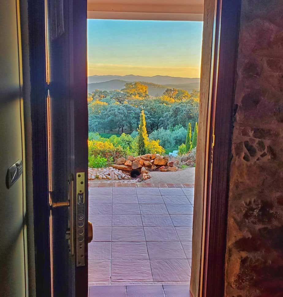 view of hills and trees through a doorframe