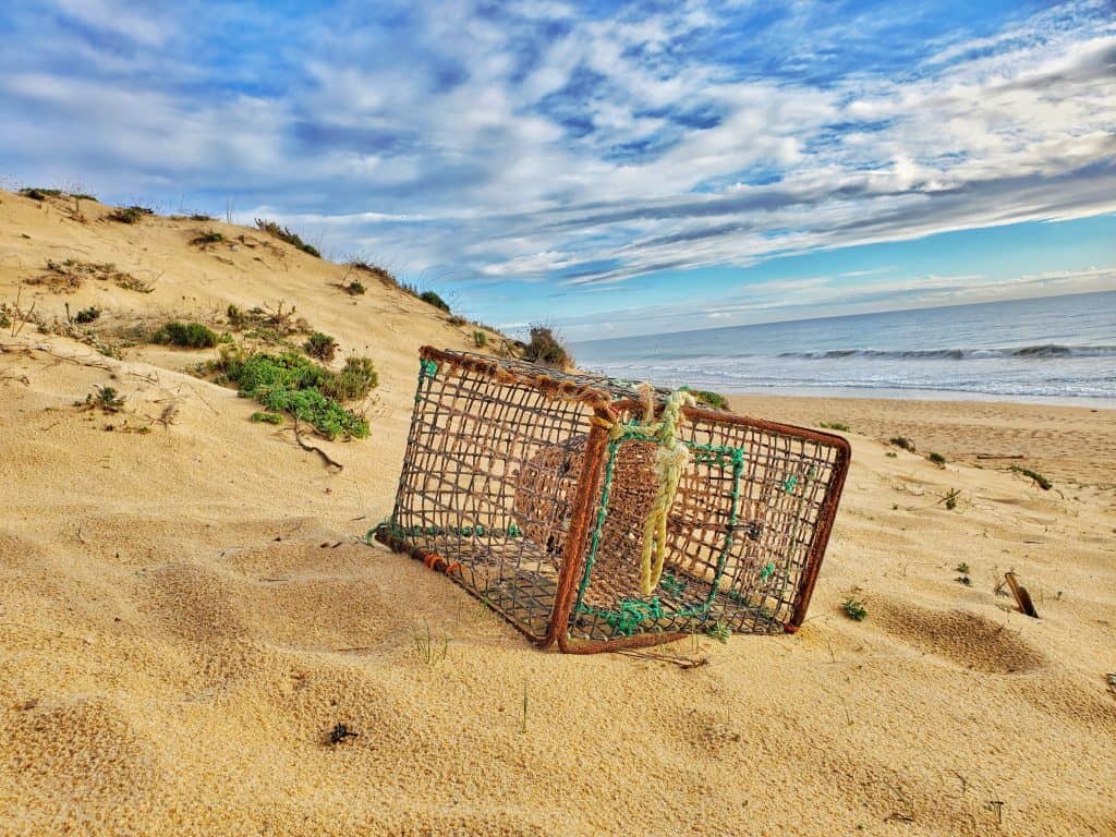 fishing net-box on sandy beach