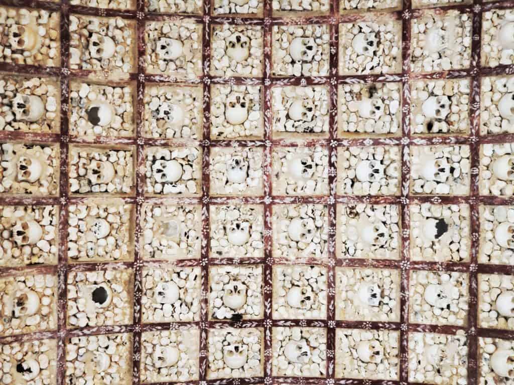 view up of ceiling made of bones and skulls
