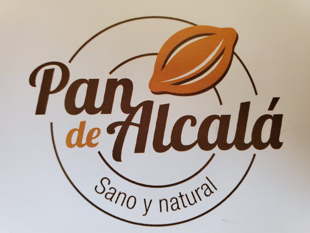 logo reading "Pan de Alcalá, sano y natural"
