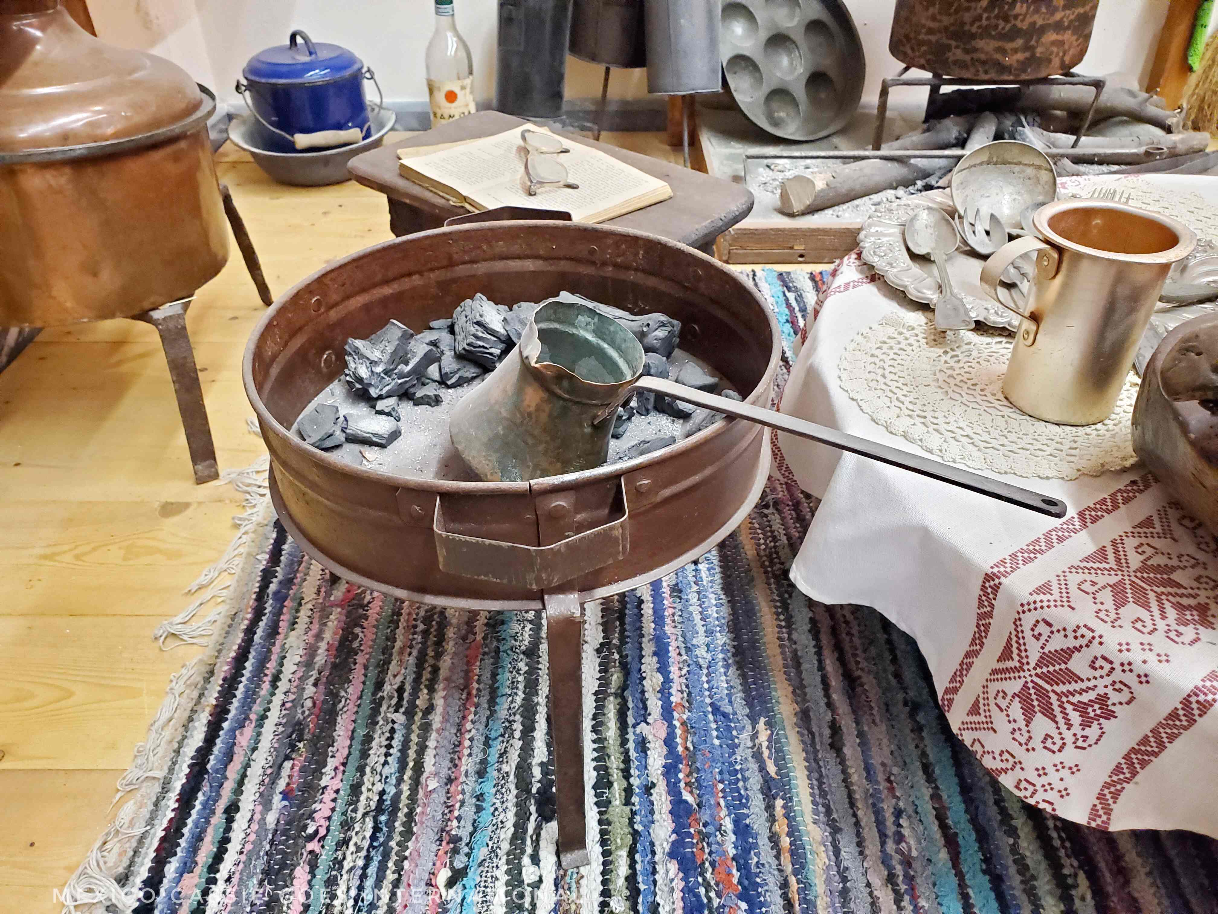 old fashioned coffee making set on a rag rug