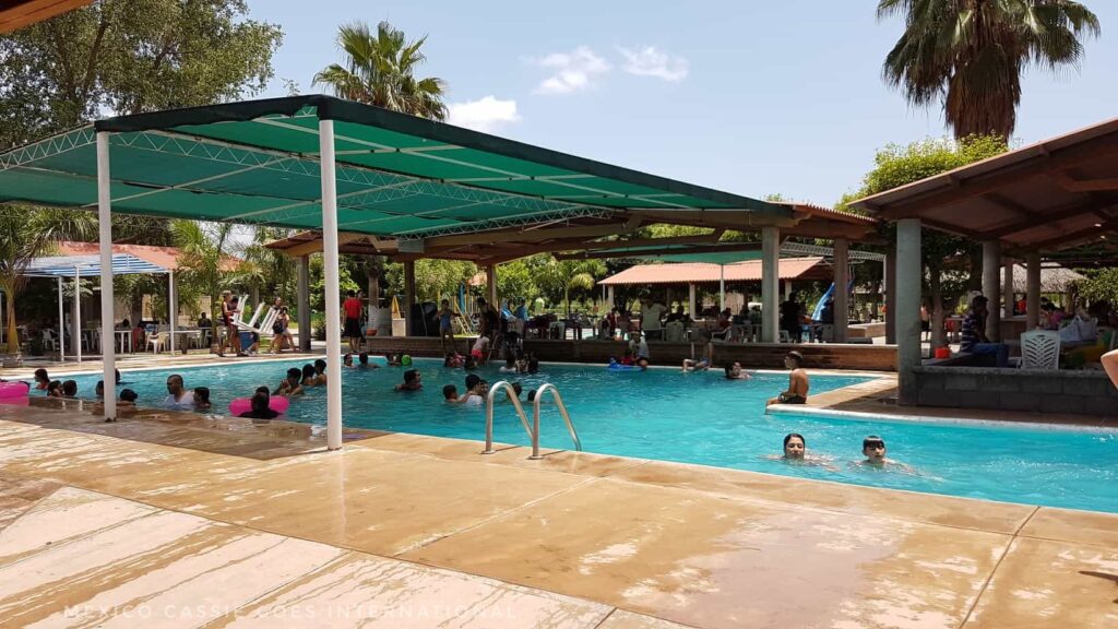 outdoor pool with shaded roof covering