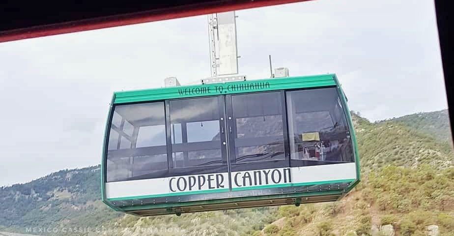 copper canyon cable car - green top, glass, white bottom