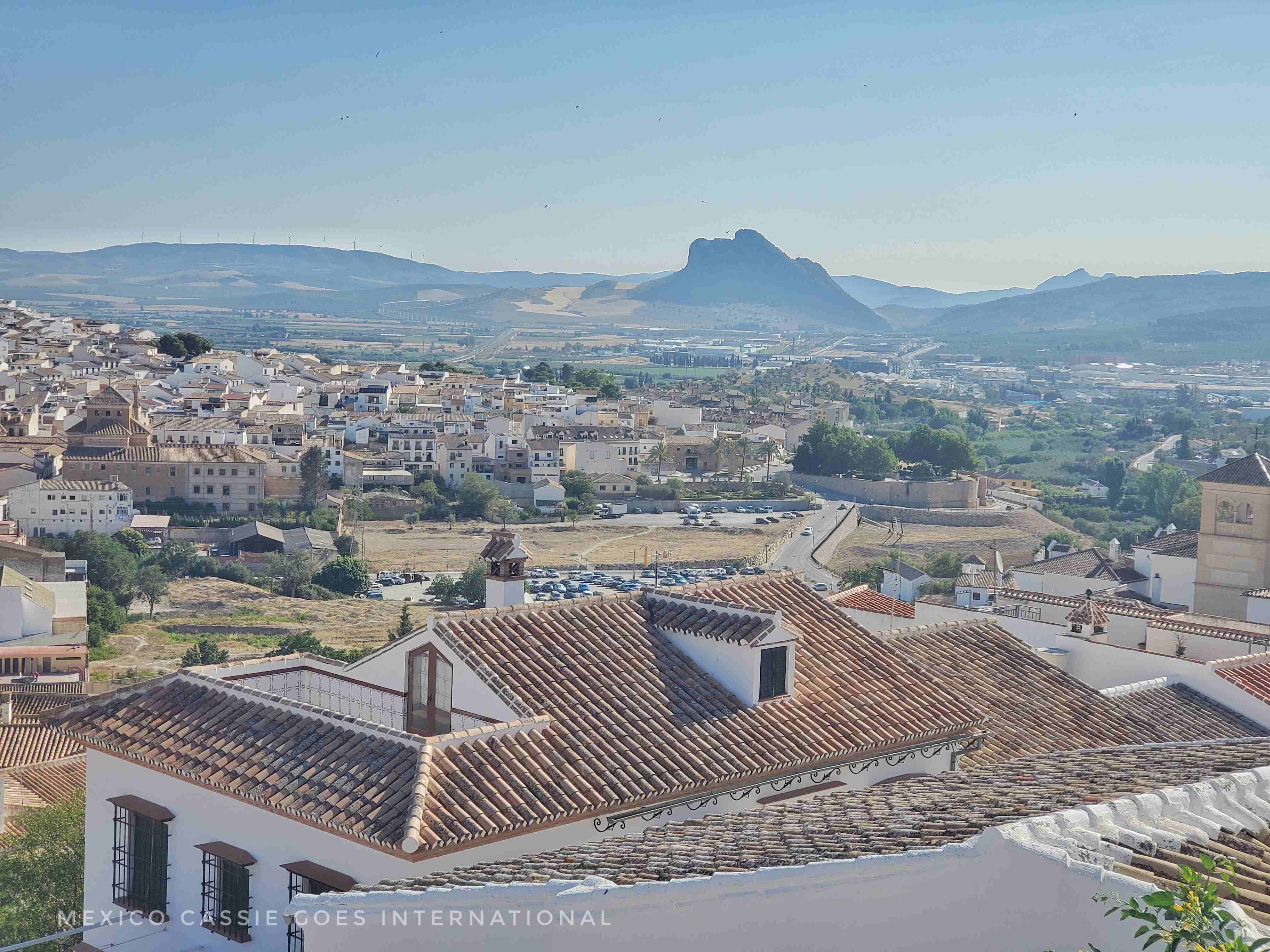view over roofs of Antequera. Rocks resembling a prone face in background