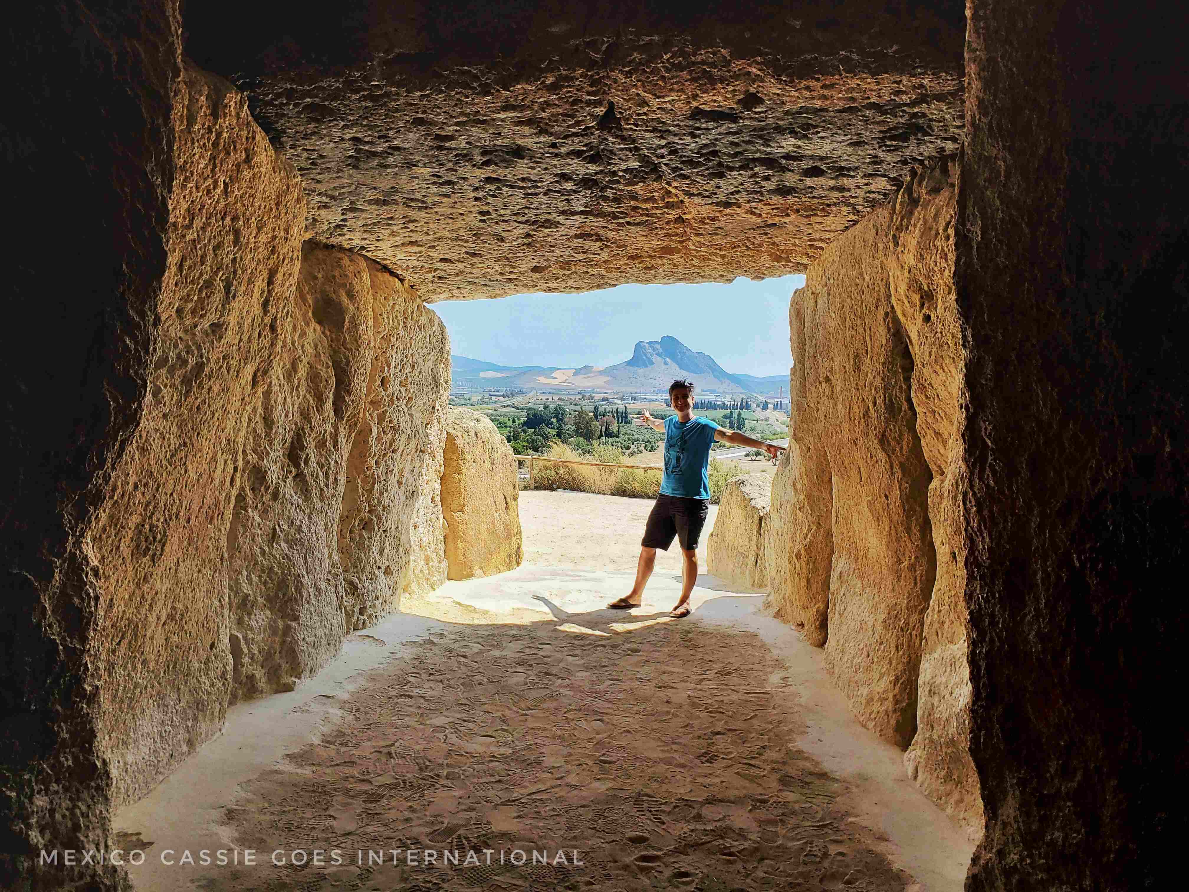 view from inside a dolmen. cassie in foreground and prone peña de los enamorados in background