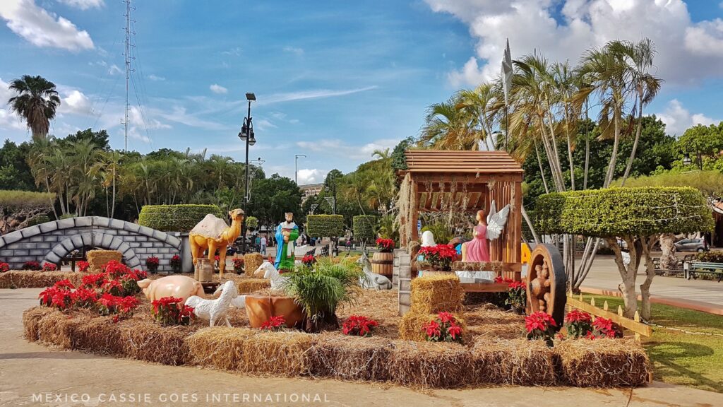 bright daylight, large plaza nativity scene surrounded by ham