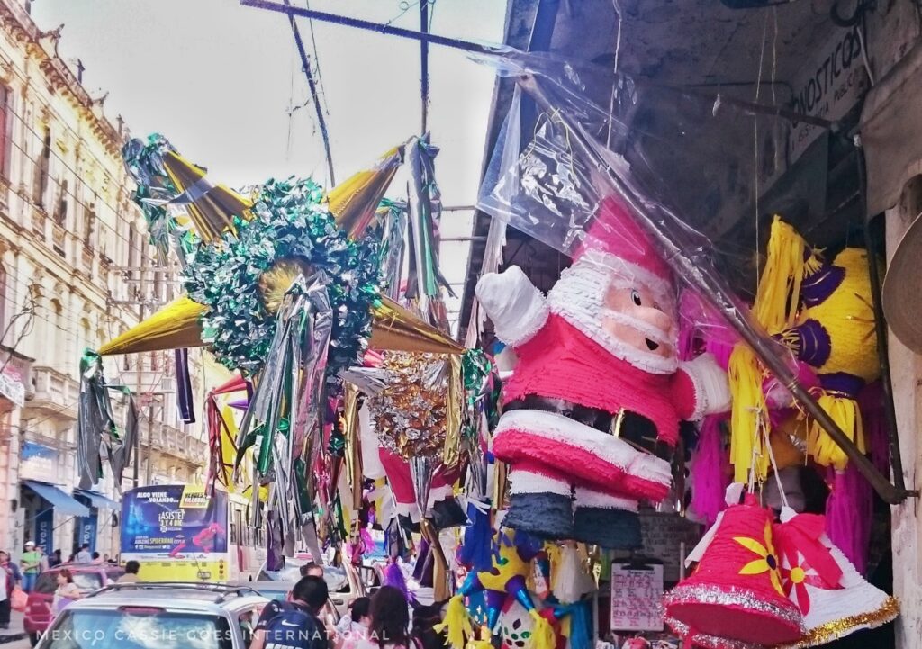 piñatas hanging - santa and traditional christmas round one