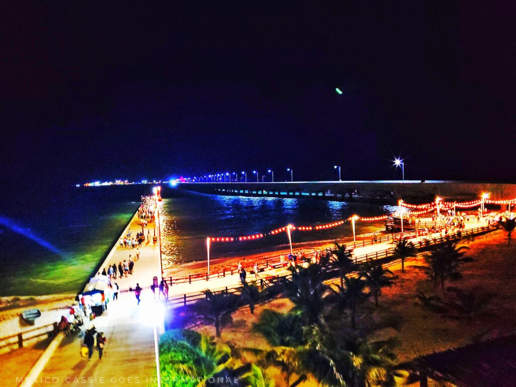 view of piers lit up at night