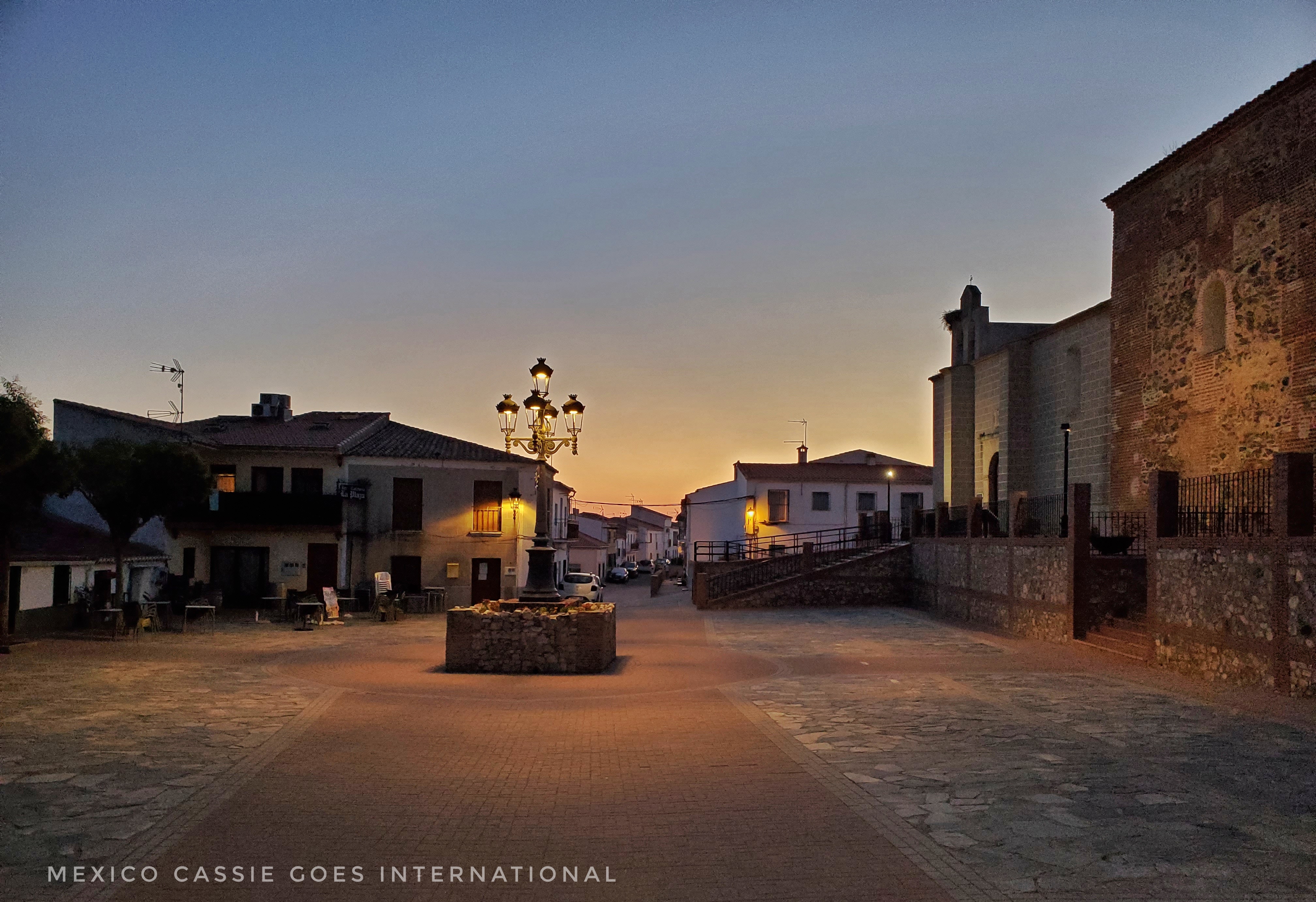 empty Spanish town plaza at dusk. 