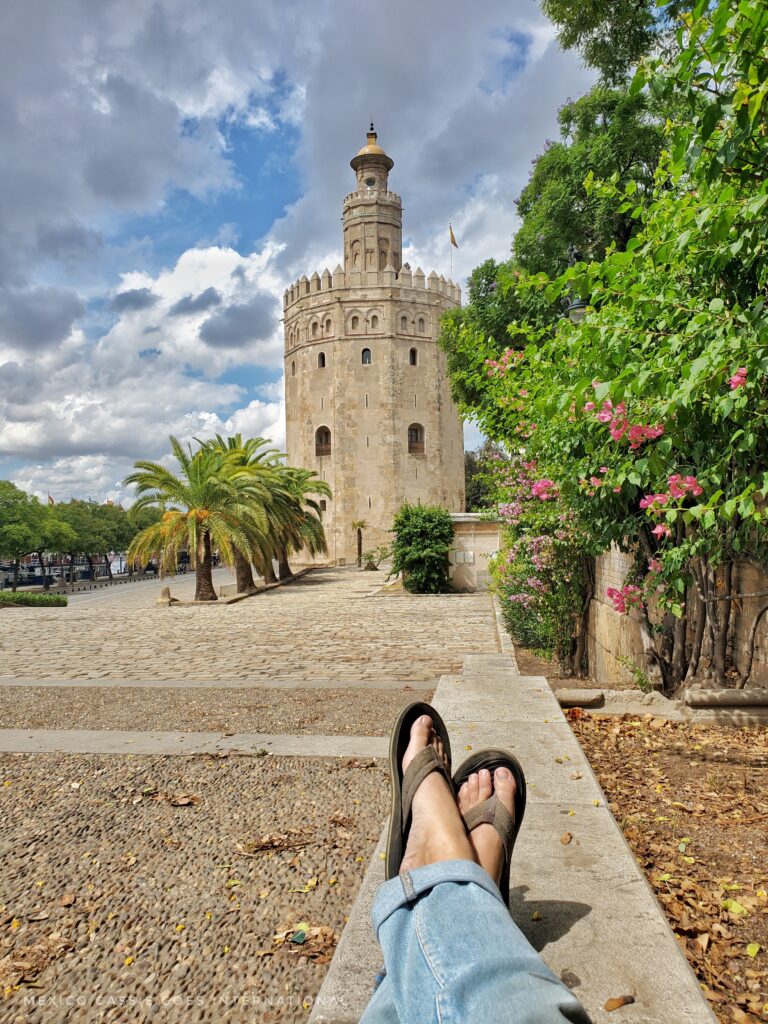 12 sided tower. pair of feet in flip flops in foreground (belonging to photographer)