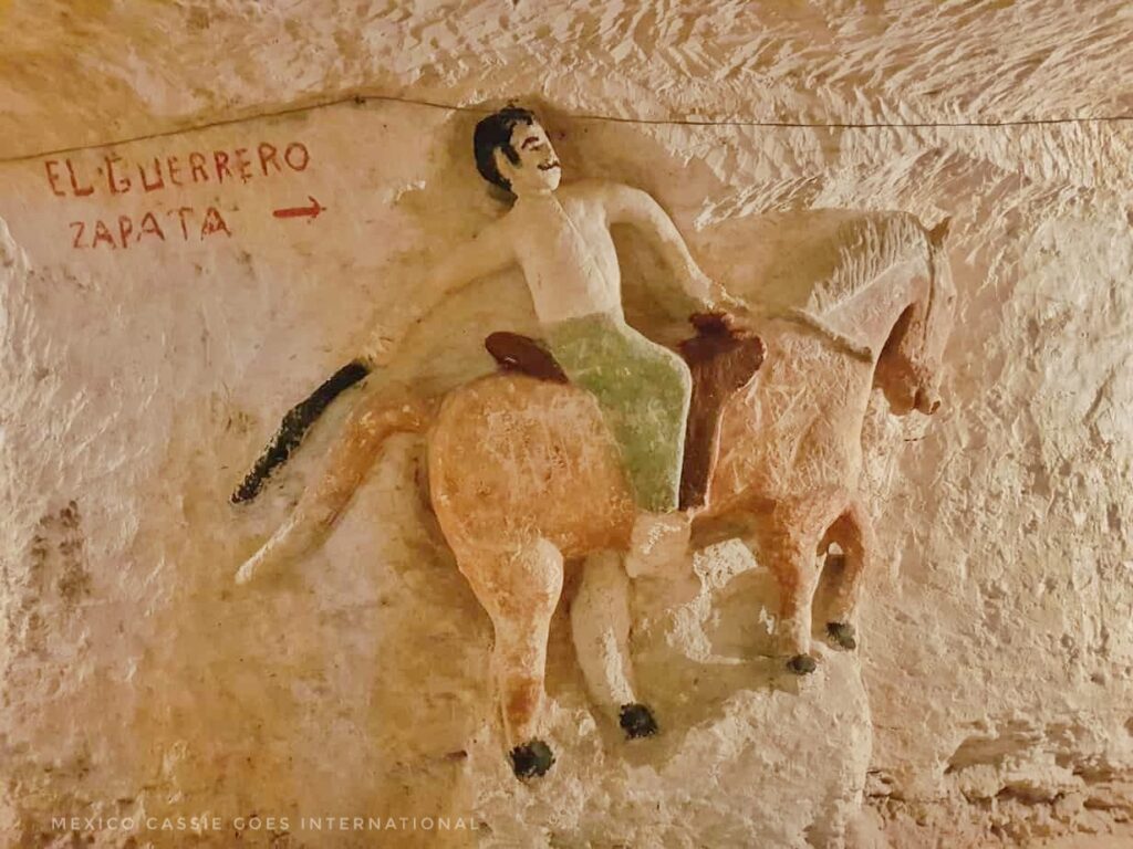 wall carving on topless man on a horse (not sexy!)