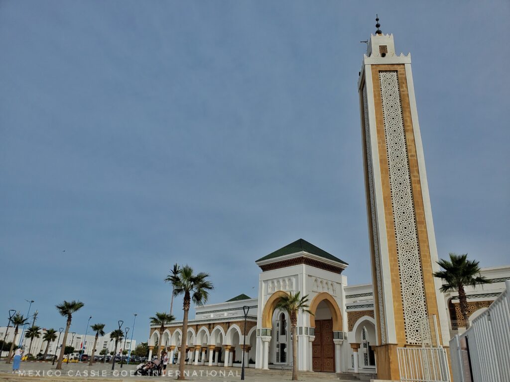 view of a modern mosque with tall, square minaret