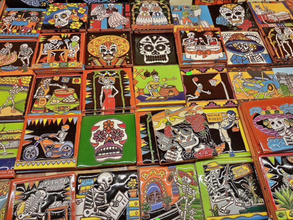 photo of Puebla tiles - all skeletons or skulls doing modern activities