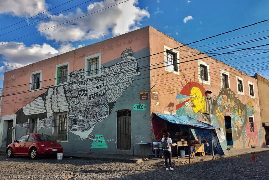 building with murals on each wall