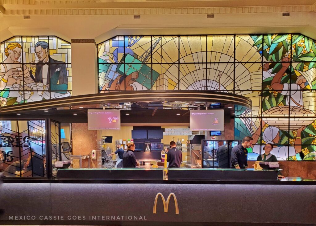 McDonald's counter, staff working, art deco windows behind and above