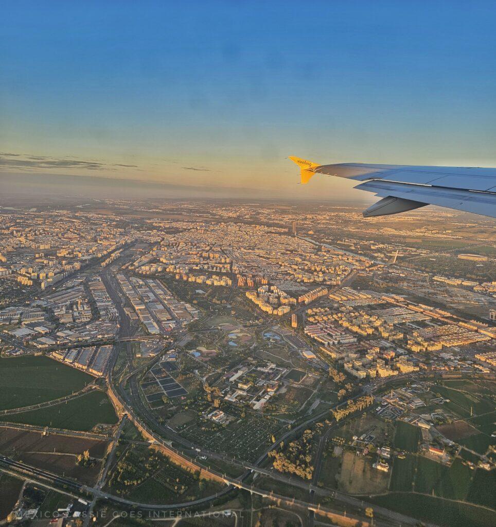 Sevilla from plane window, can also see wing of plane on right hand side of photo
