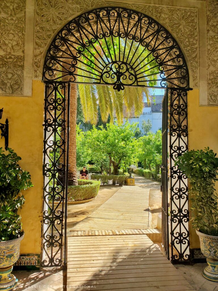 wrought iron around a doorway onto an ornamental garden
