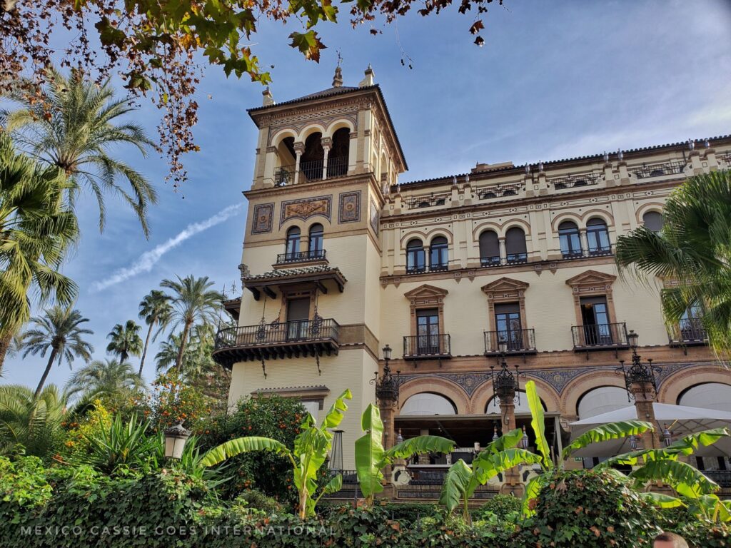 Alfonso XIII from the outside - 4 storey building with turret tower on left end. trees all around