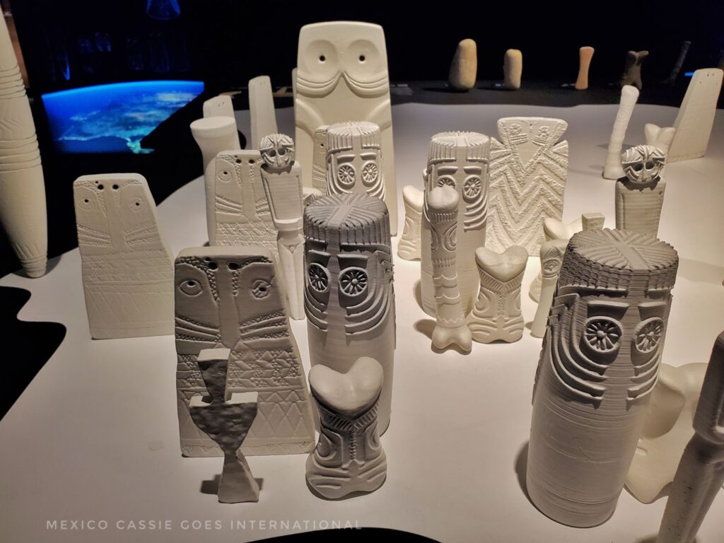 group of white plaster models of prehistoric idols