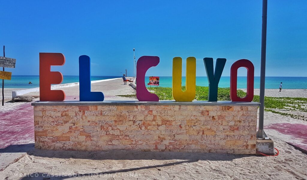 el cuyo sign in front of pier and beach