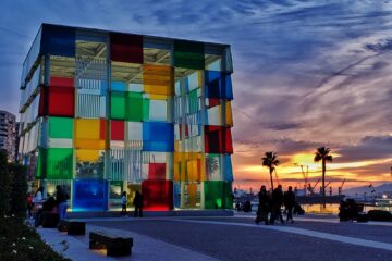 Pompidou box in Malaga - cleear, red, yellow, green and blue squares of glass making a large box. Dusk