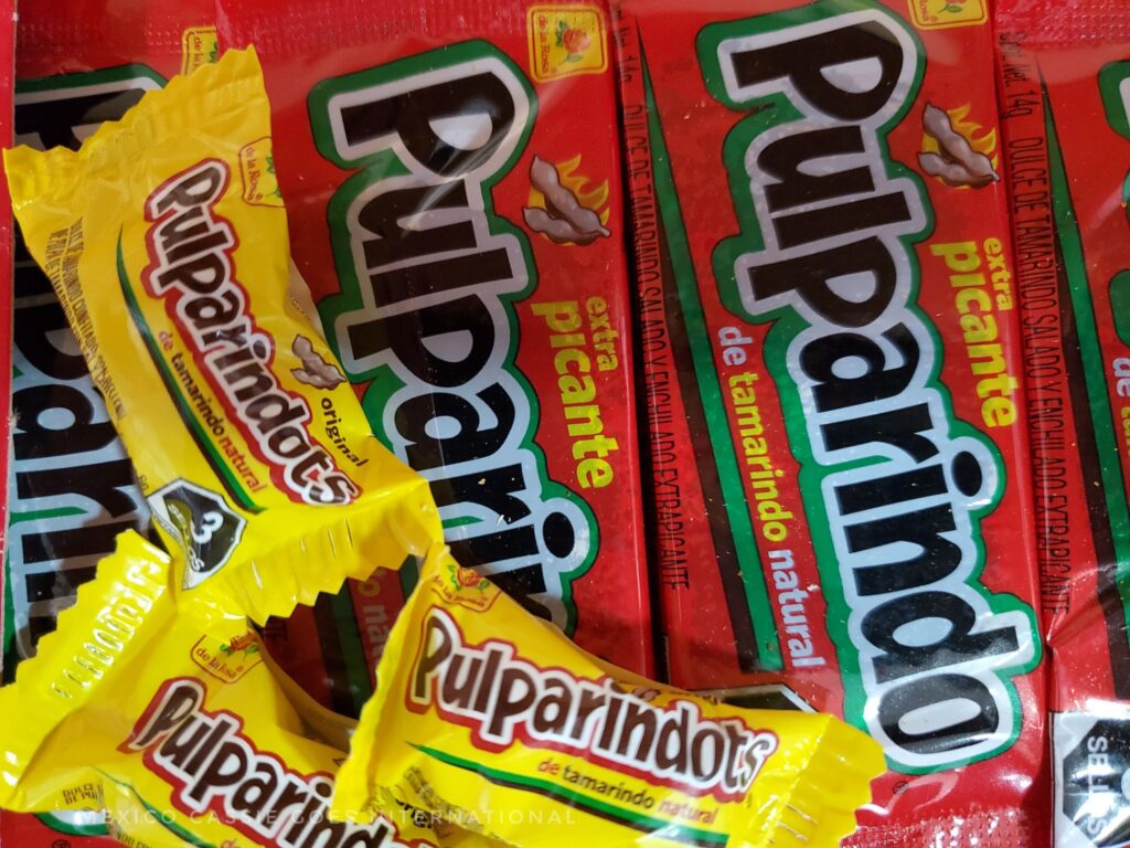 close up of red pulparindo and yellow pulparindot packaging