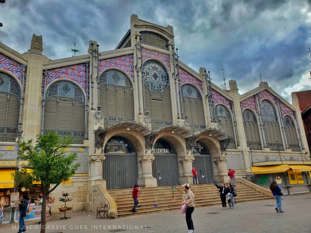 Valencia market from the outside - steps up to entrance (3 arches) 6 large stained glass windows