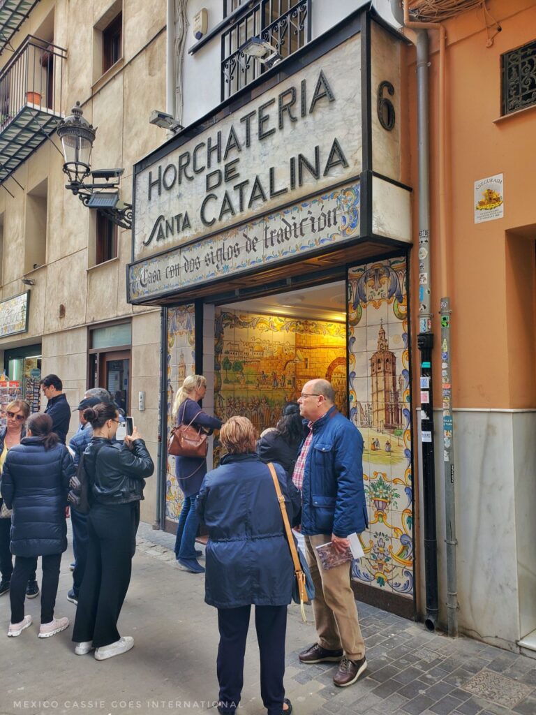 entrance to the Horchateria de Santa Catalina - this text above door, people standing around taking photos