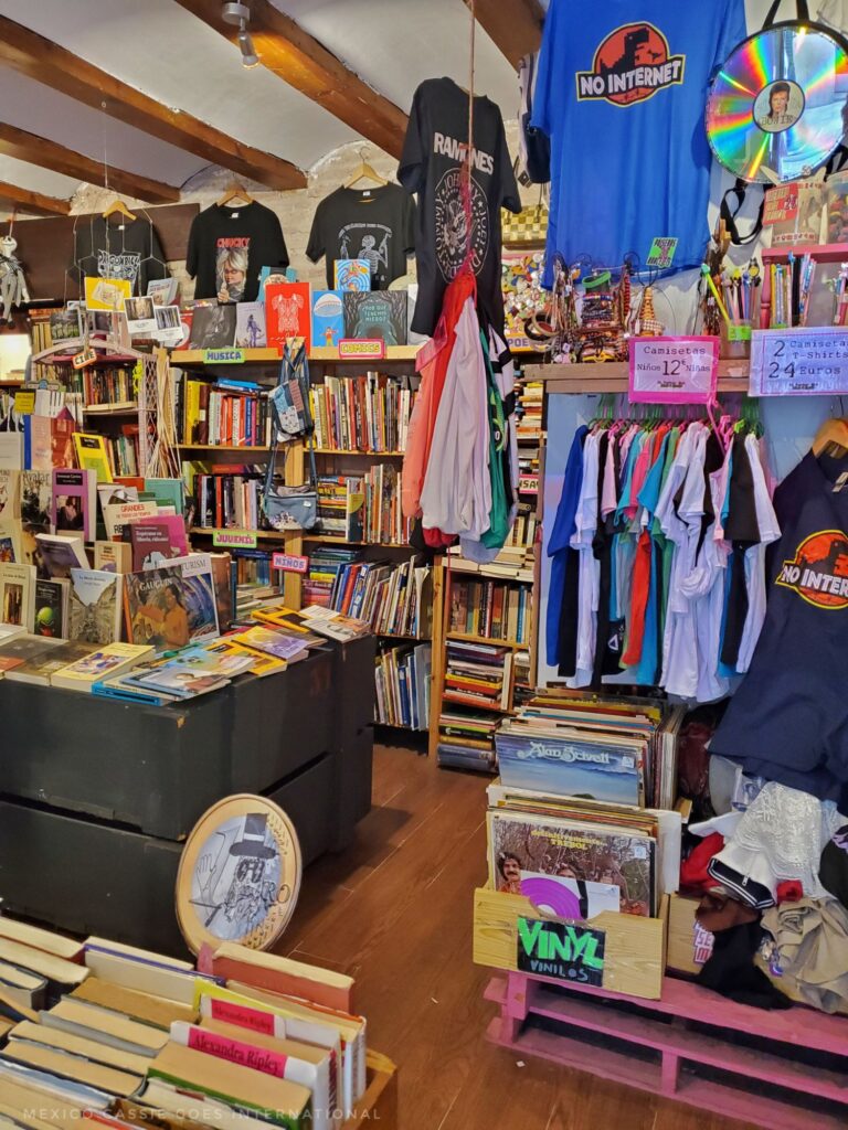 interior of an eclectic shop selling books, tshirts and more