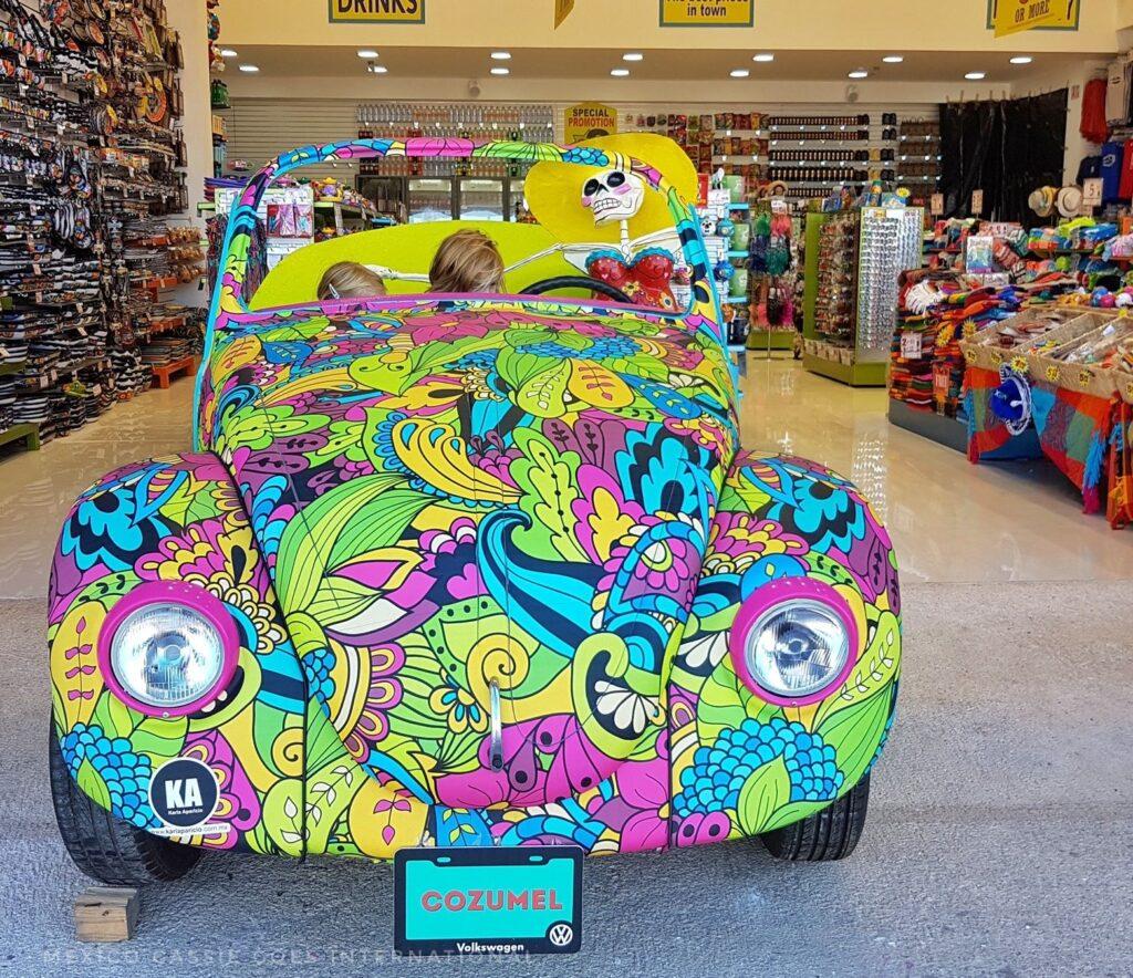 brightly coloured vw bug (inside a tourist store)