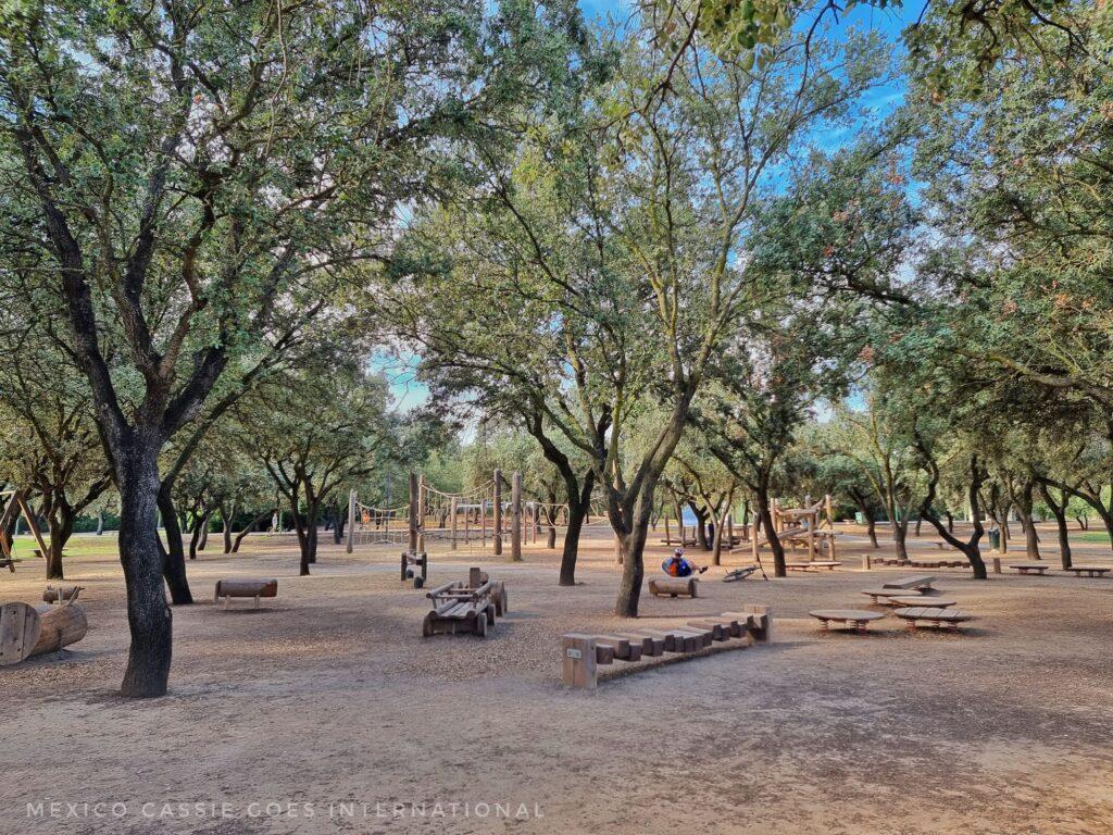 view of wooden playground equipment shaded by trees