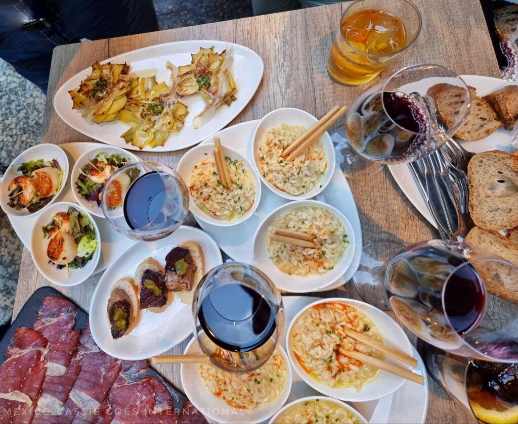 looking down over a full table of small tapas plates