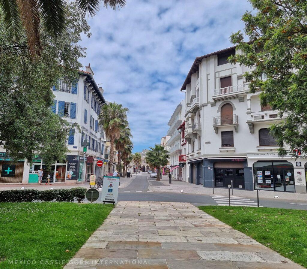 quiet stretch of a town, buildings, grass