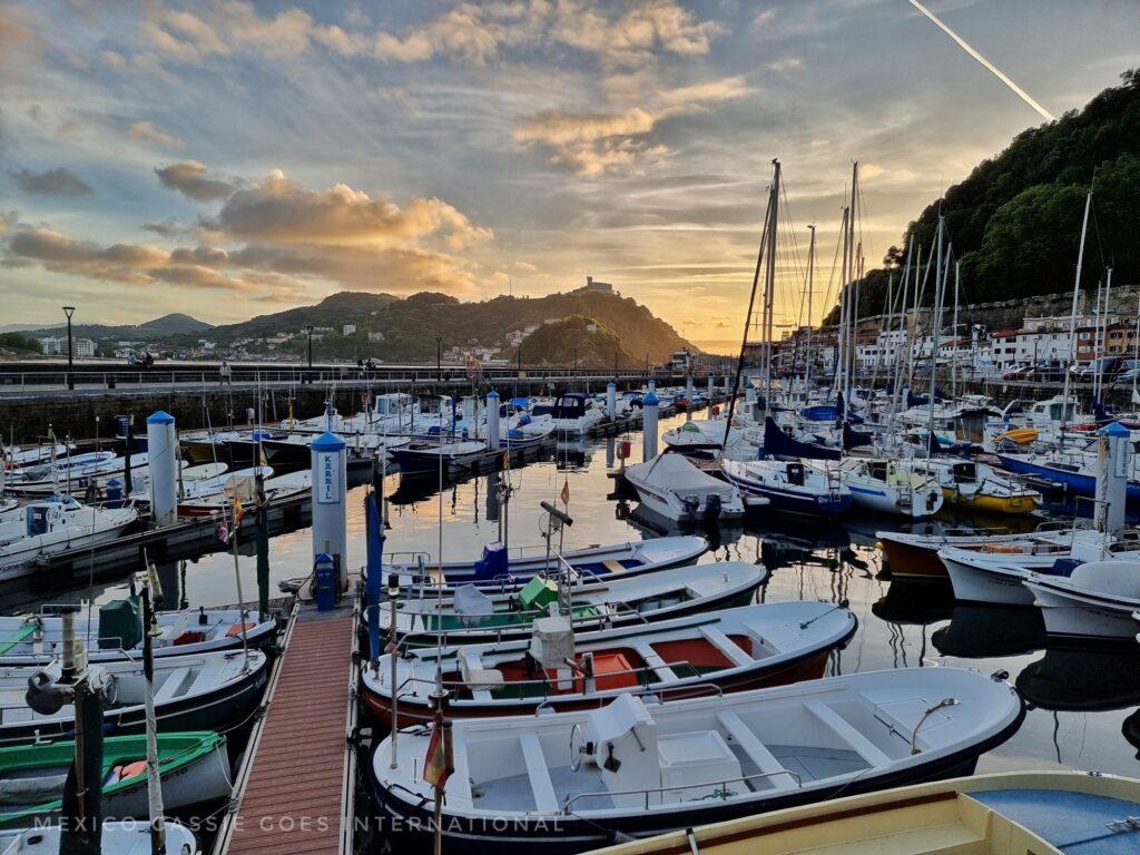 small boats in a gentle harbour at dusk