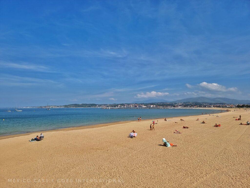 near empty sandy beach on clear day